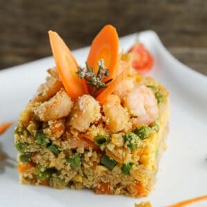 square of shrimp fried rice on white plate