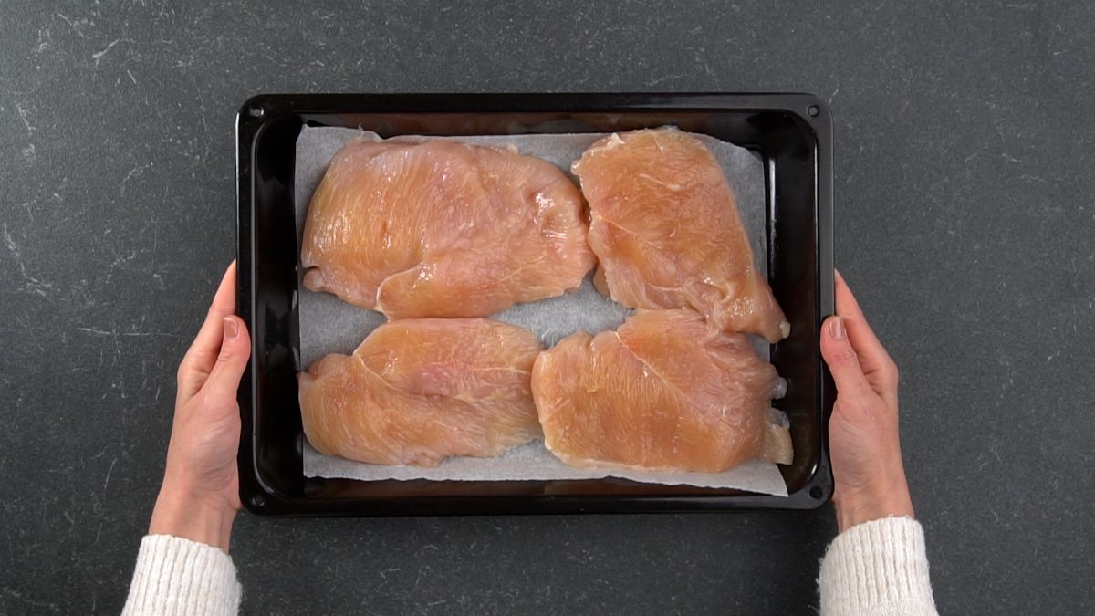 chicken breasts on baking sheet