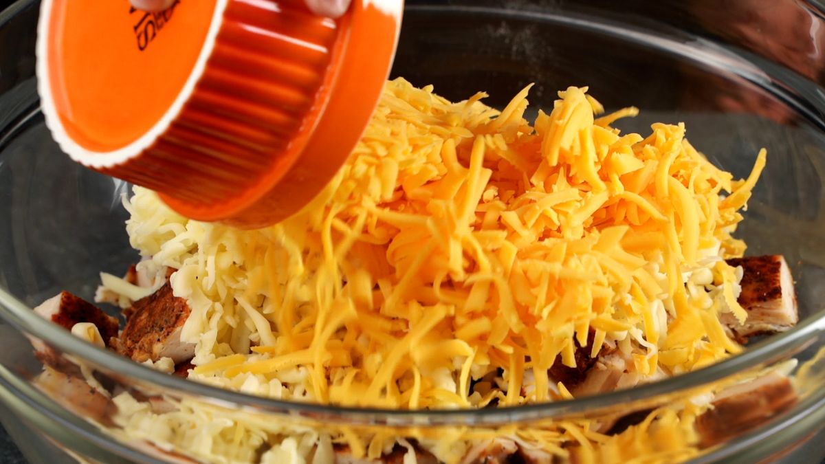 shredded cheese in bowl with chicken and rice