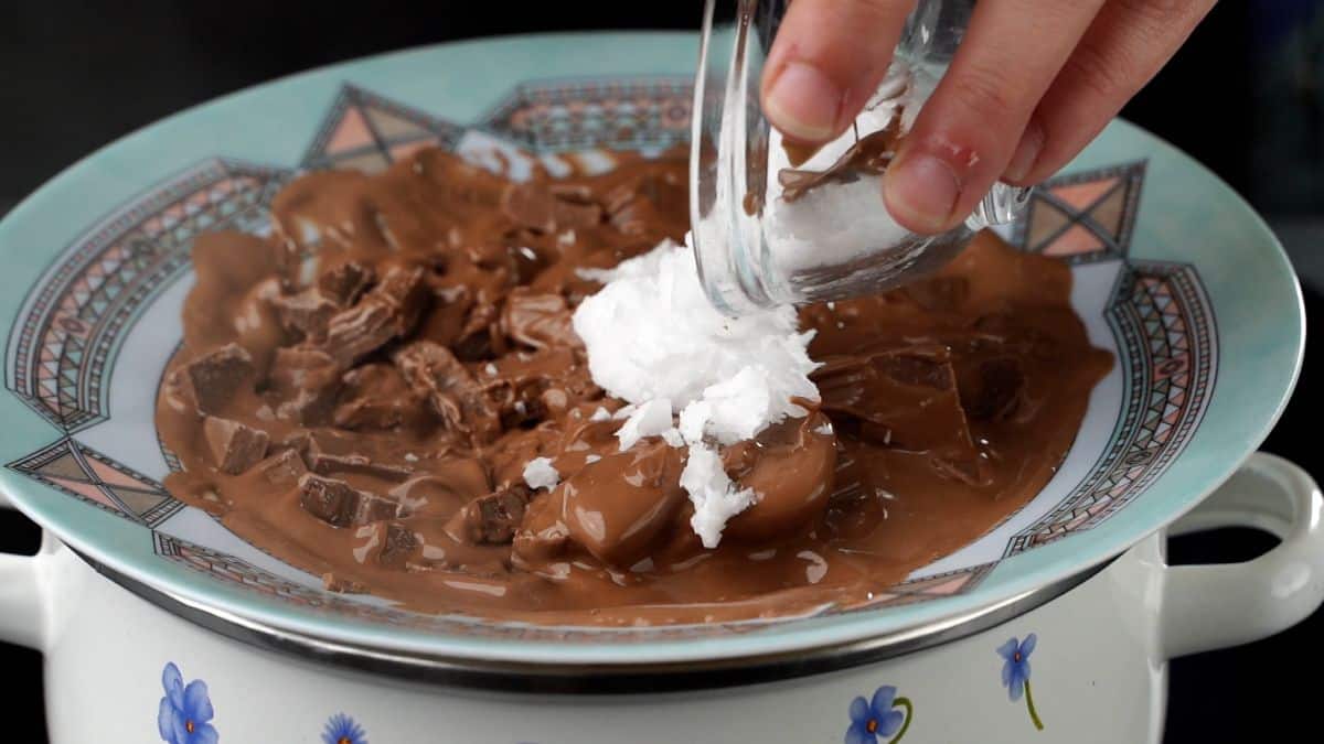 chocolate and coconut oil pieces in bowl melting