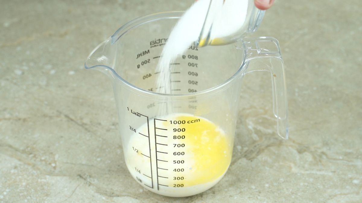sugar butter and yeast in measuring cup