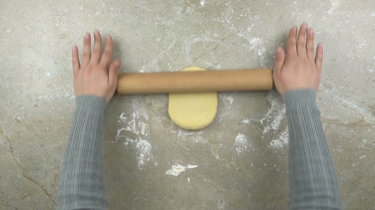 rolling dough on clean surface