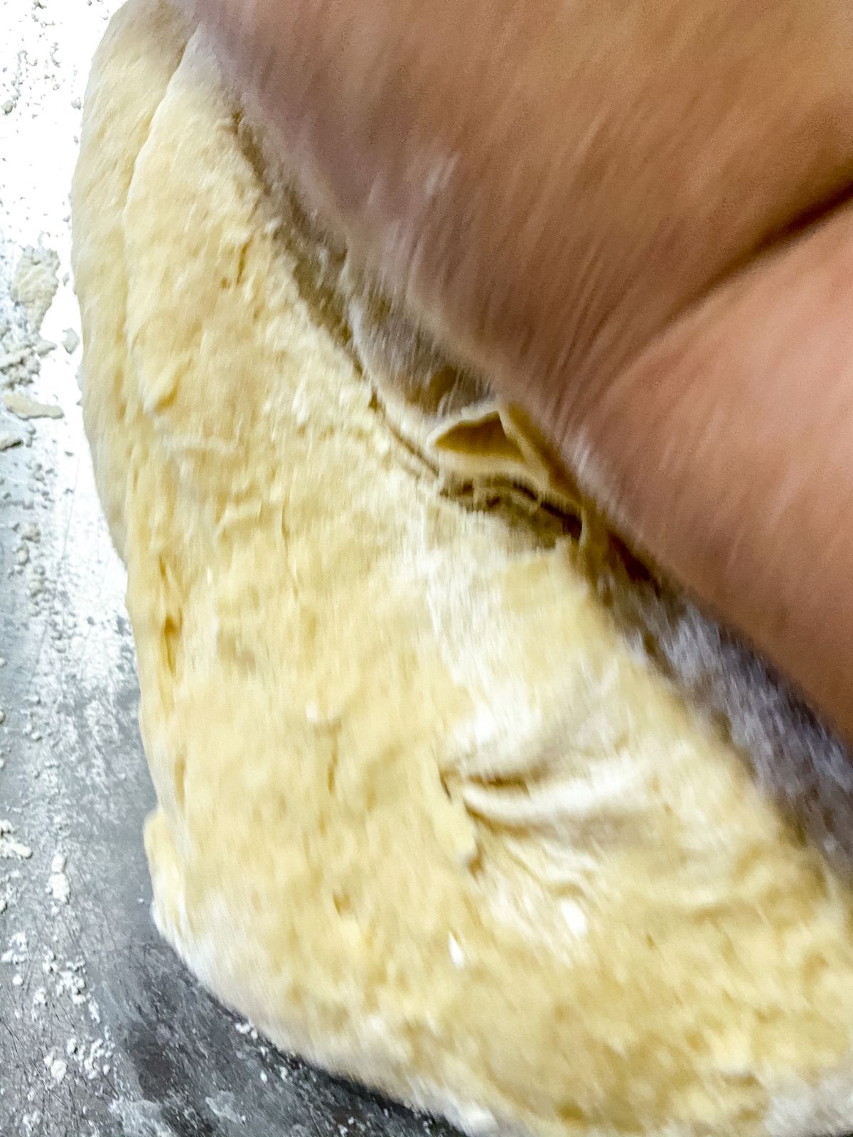 hand kneading cake dough in stand mixer