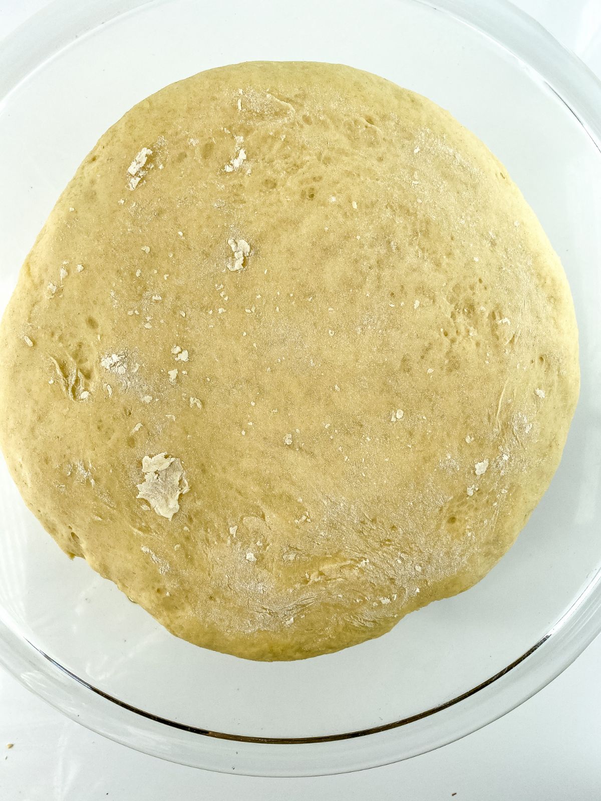 risen bowl of king cake dough