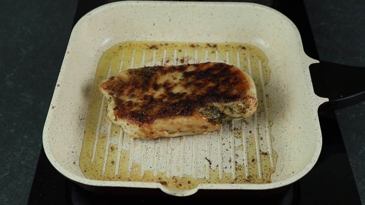 cooked chicken breast in grill pan
