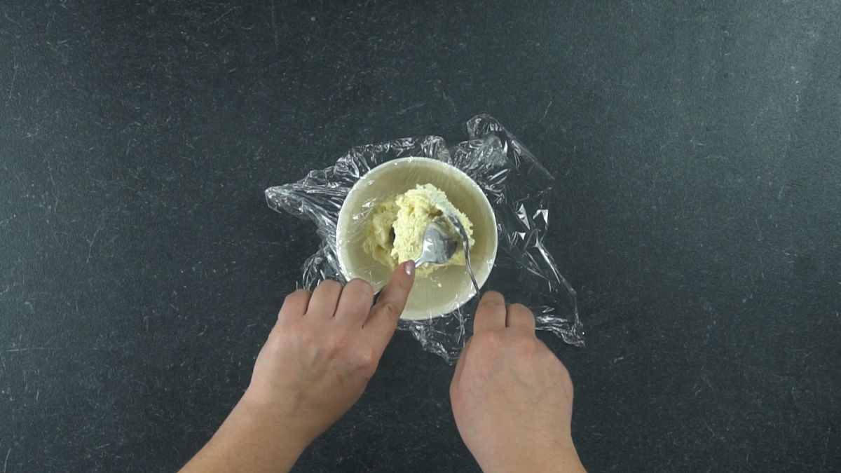 ice cream being spooned into a bowl