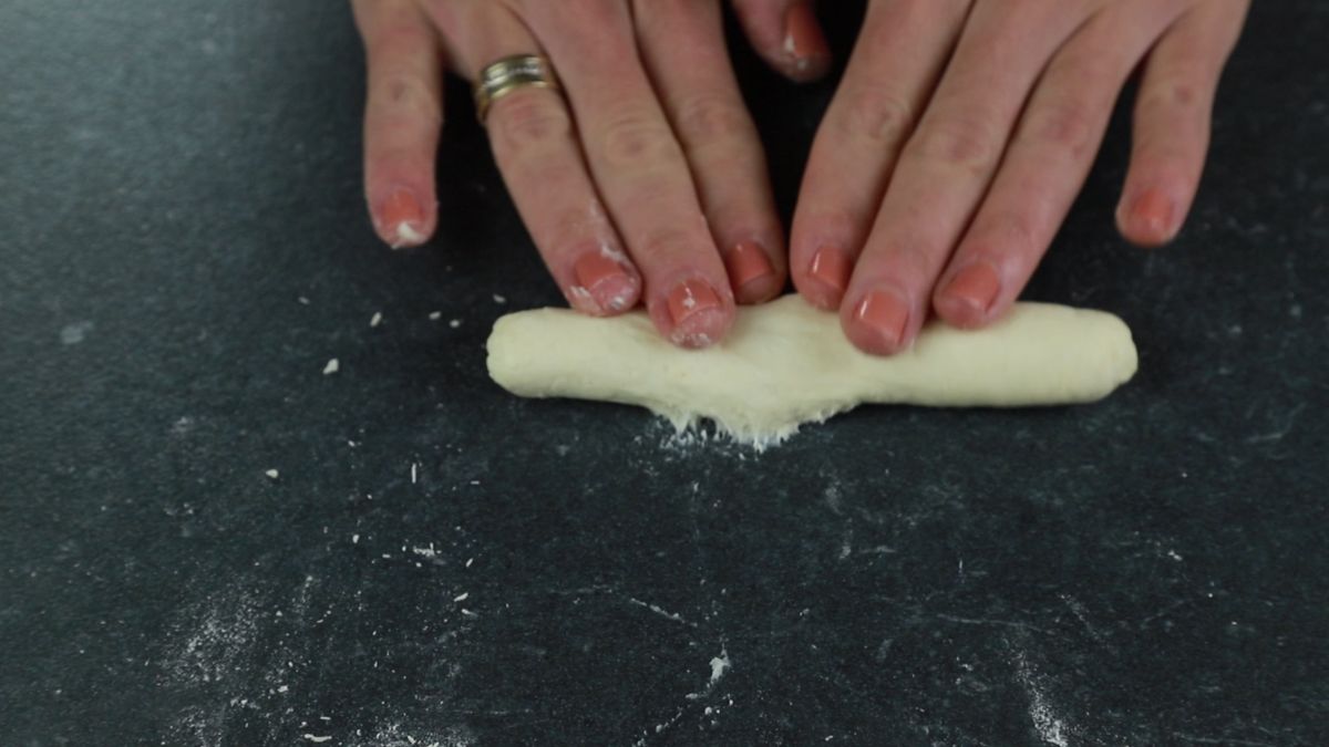 rolling out homemade donut dough