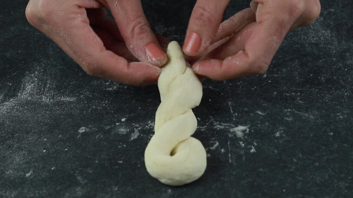 twisting dough for donut