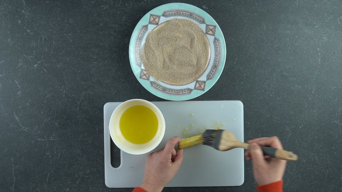 brushing bread with melted butter