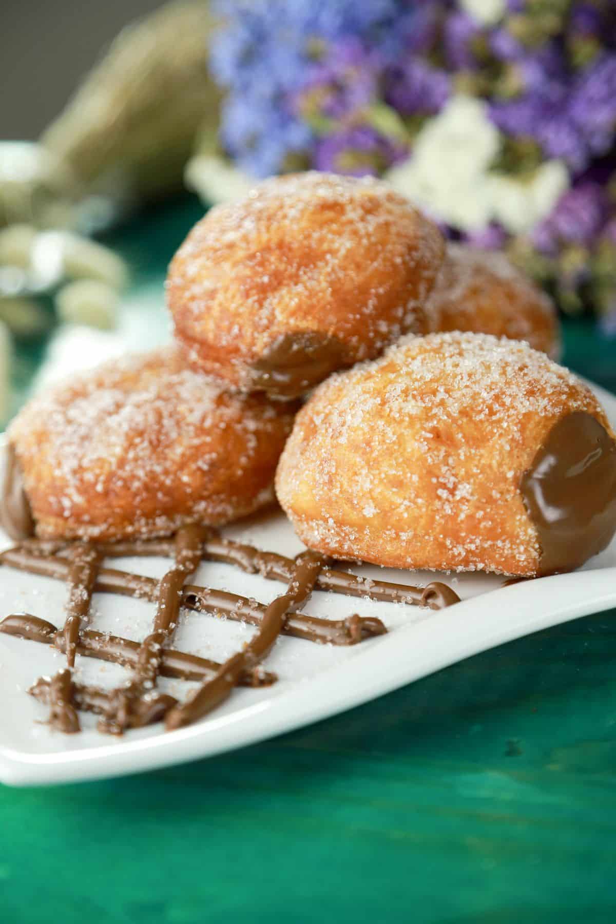 square white plate of donuts with nutella filling
