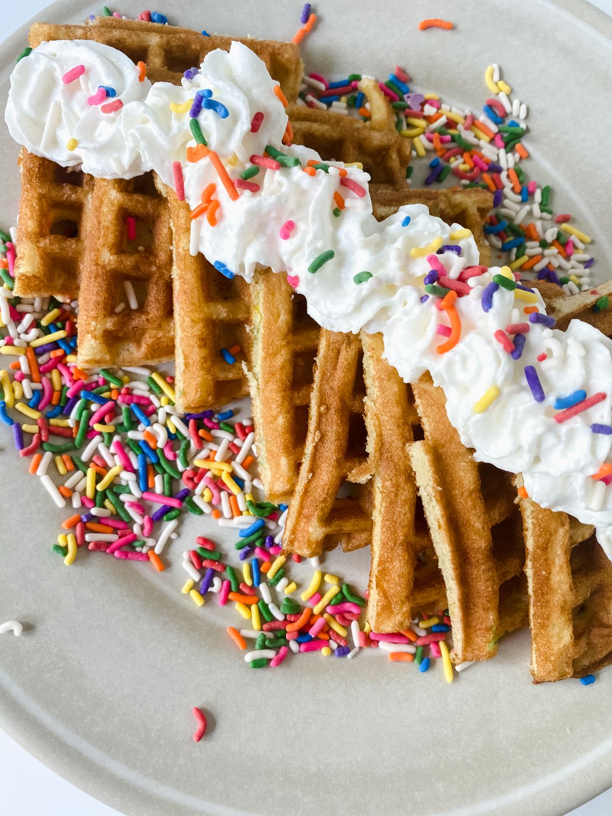 sprinkles on top of birthday cake waffles
