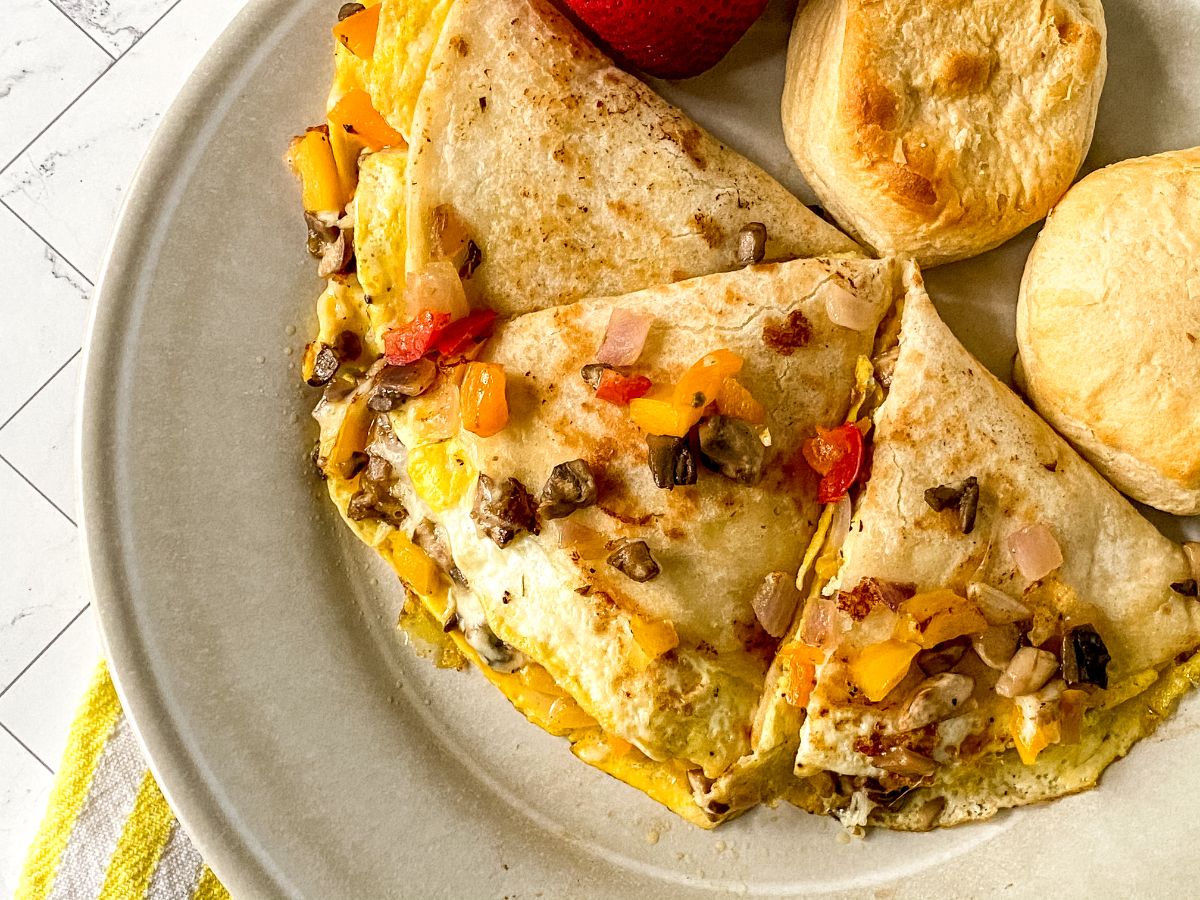 breakfast quesadillas with vegetables on light brown plate