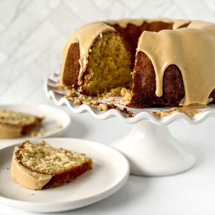 slices of buttermilk pound cake on white plates by cake stand