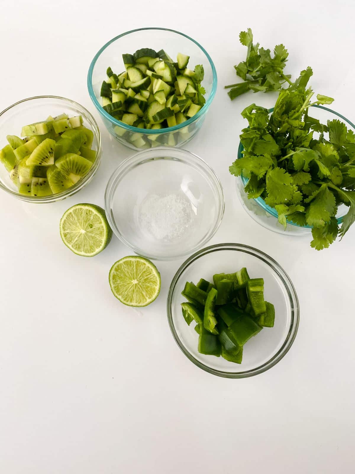 glass bowls of ingredients for relish