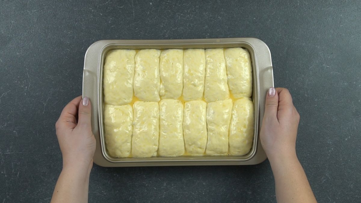 potato bread rolls in baking dish before baking