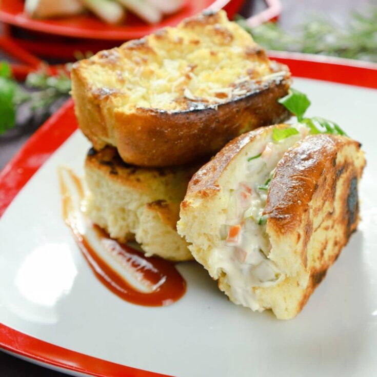 sliced potato bread rolls on white and red plate