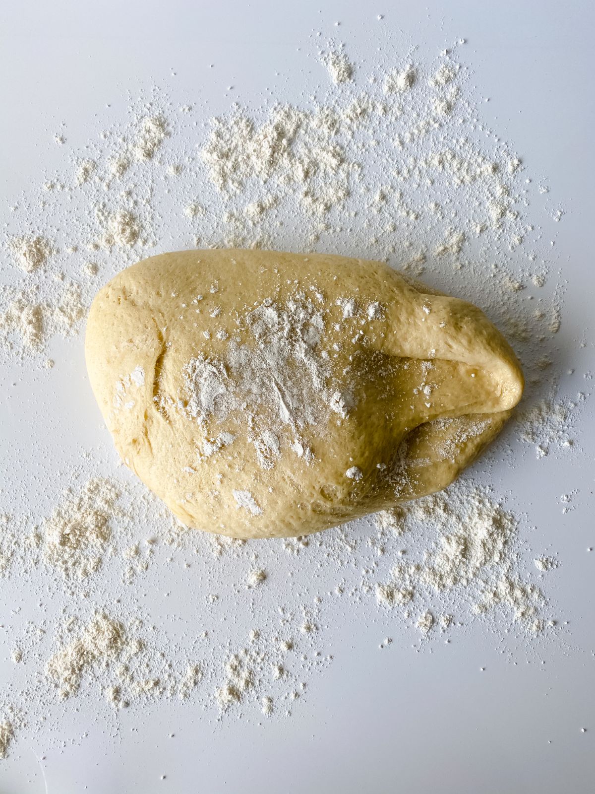 dough on table with flour