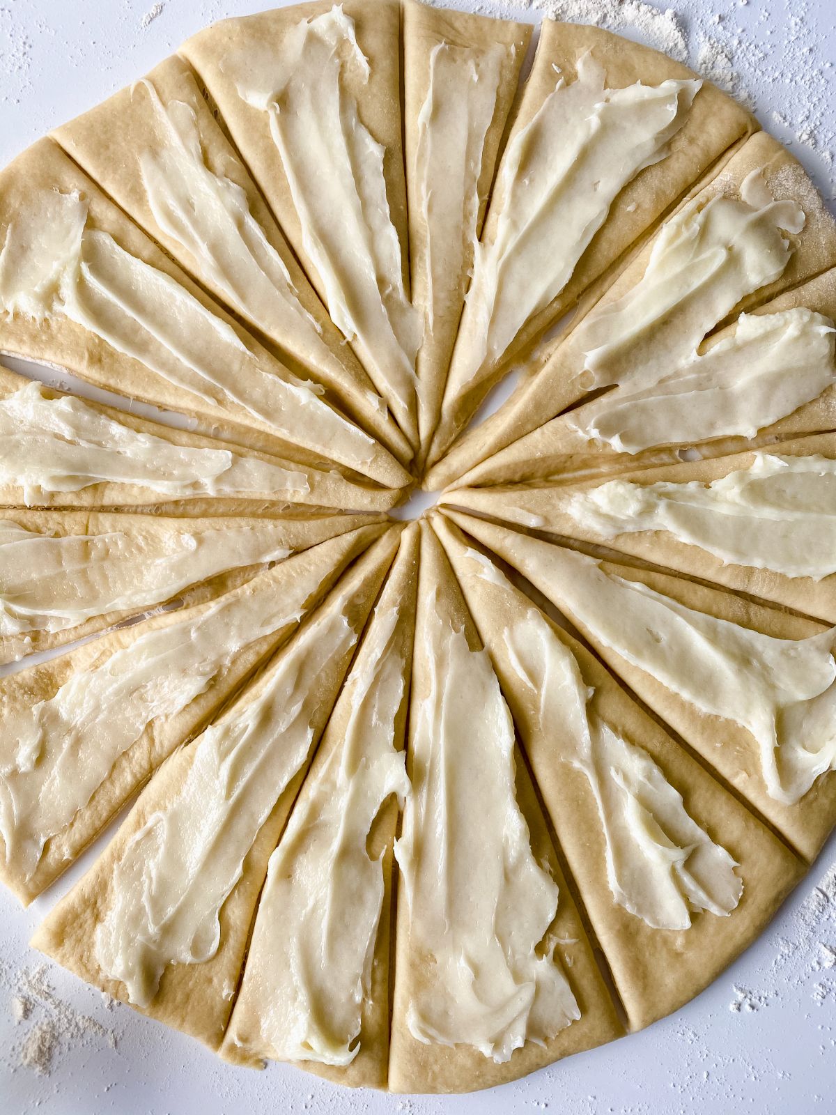 cream cheese on top of dough
