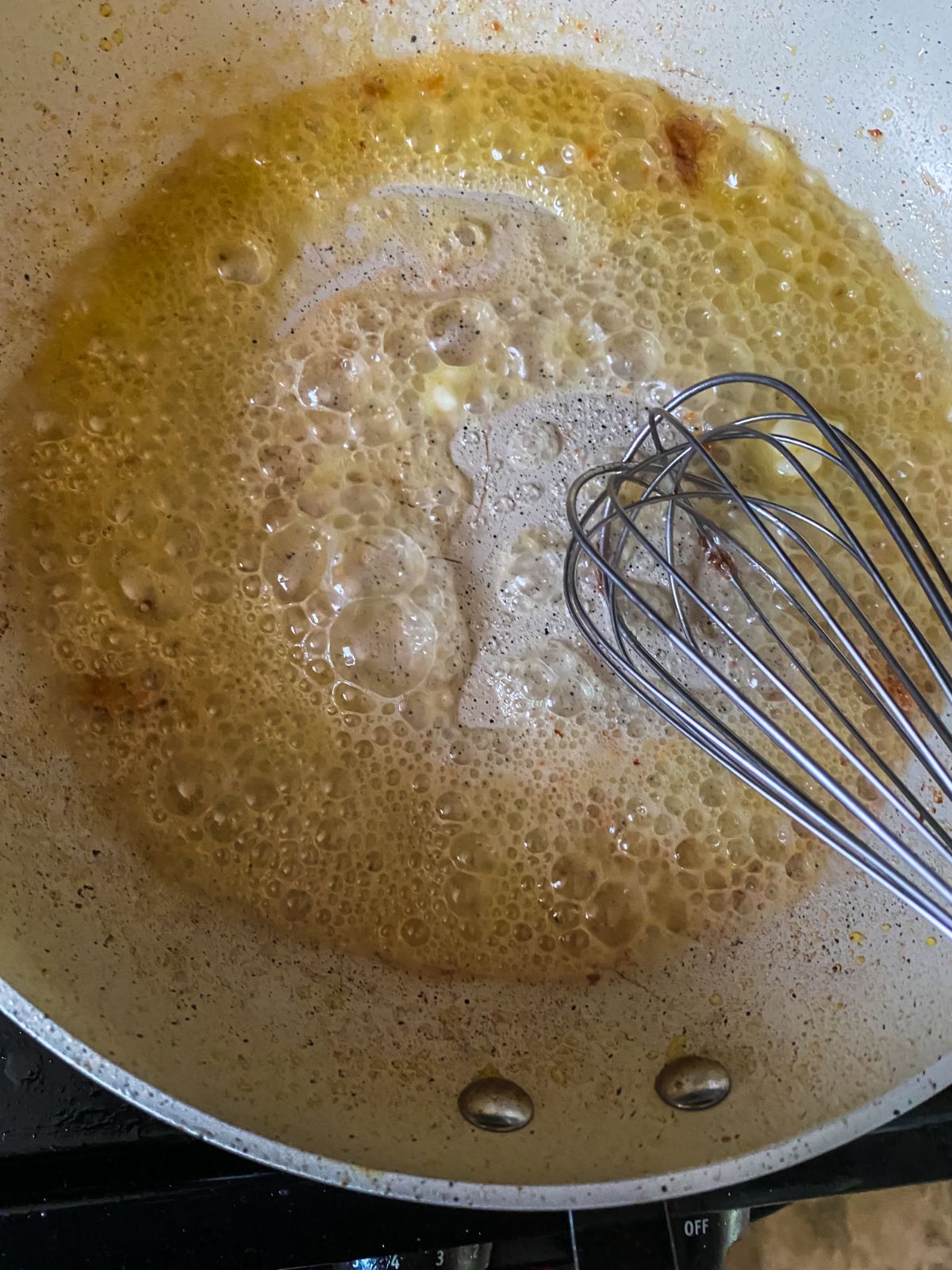 whisk stirring butter and flour together