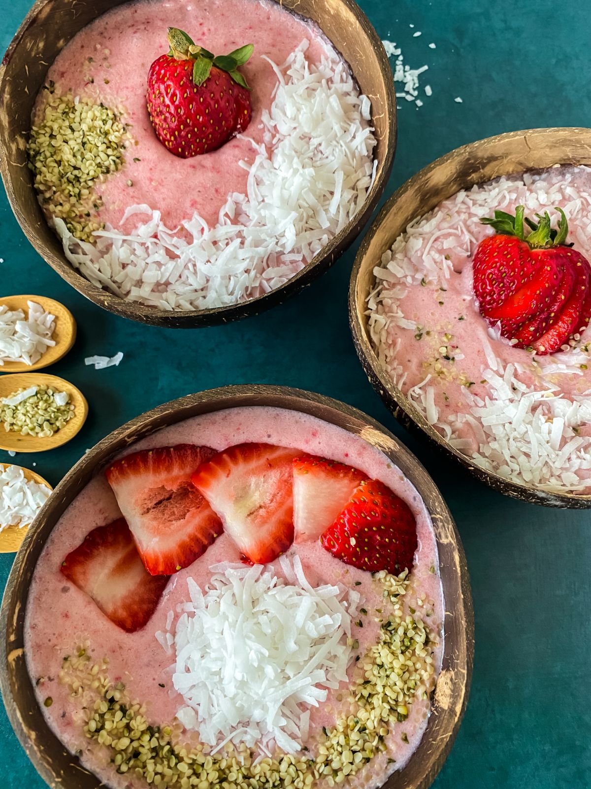 smoothie bowls on teal tablecloth