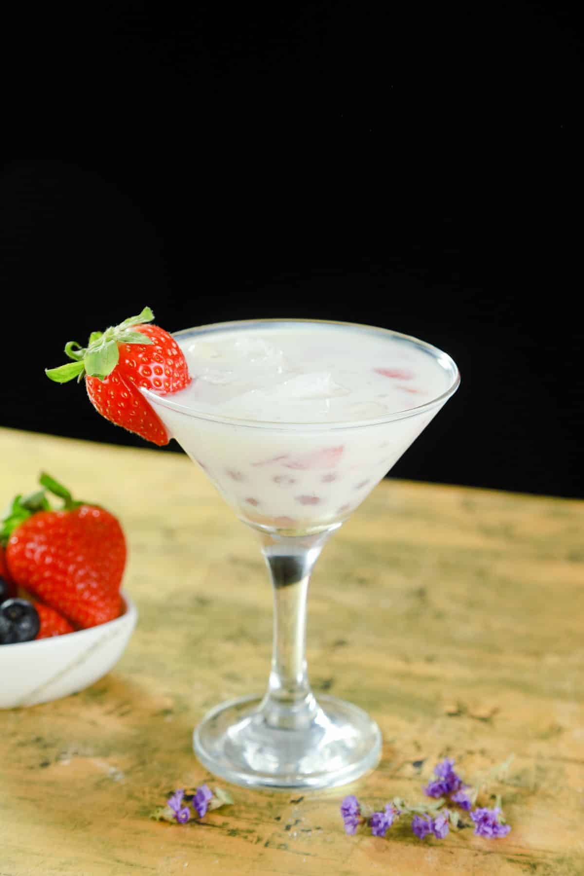 martini glass of strawberry boba milk
