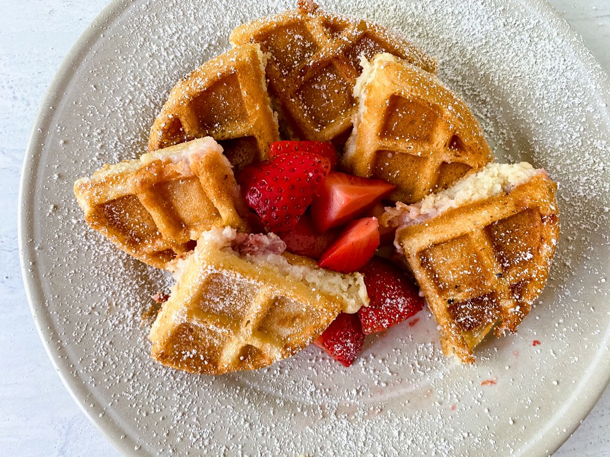 stuffed waffles with strawberries on plate