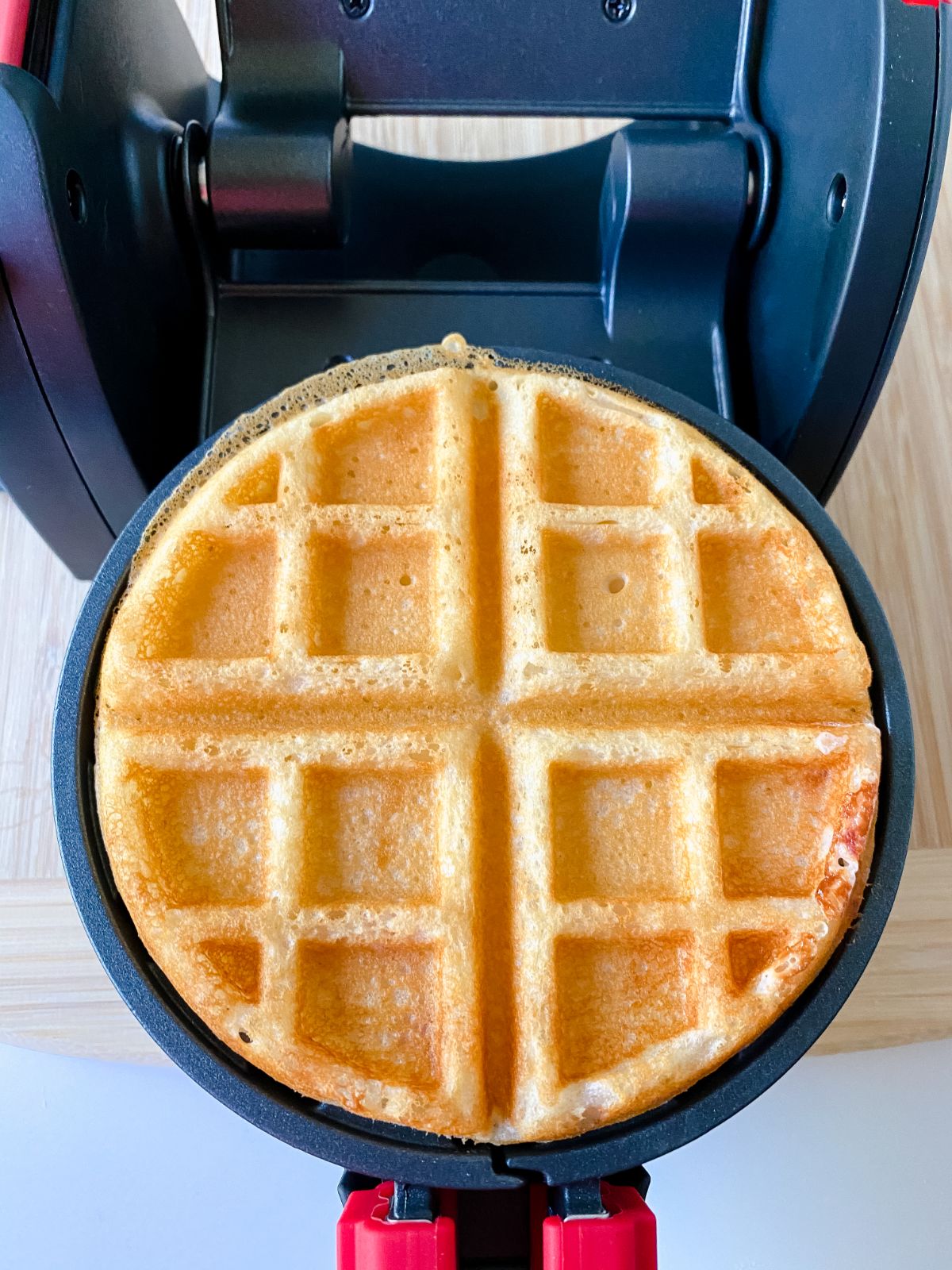golden brown waffle on waffle maker