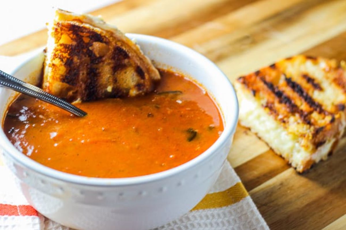 Tomato Soup and Grilled Cheese in a white bowl.