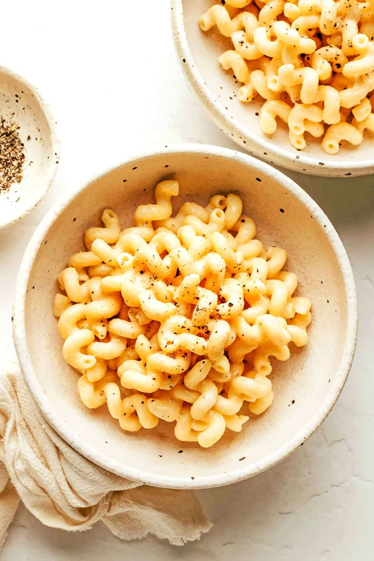 Mac and Cheese in two white bowls.