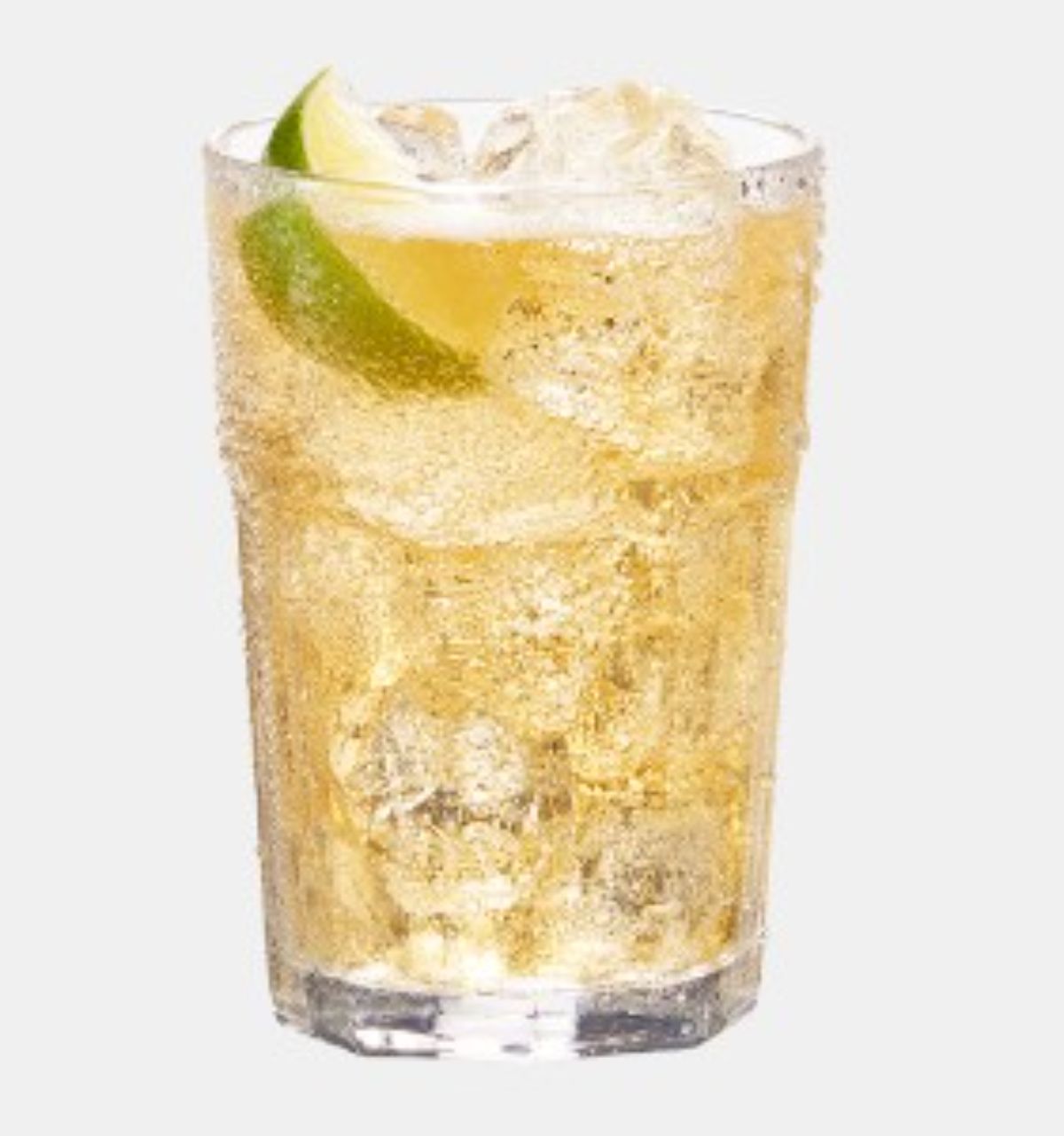 Captain and Ginger rum cocktail in glass cup with ice and a slice of lime.