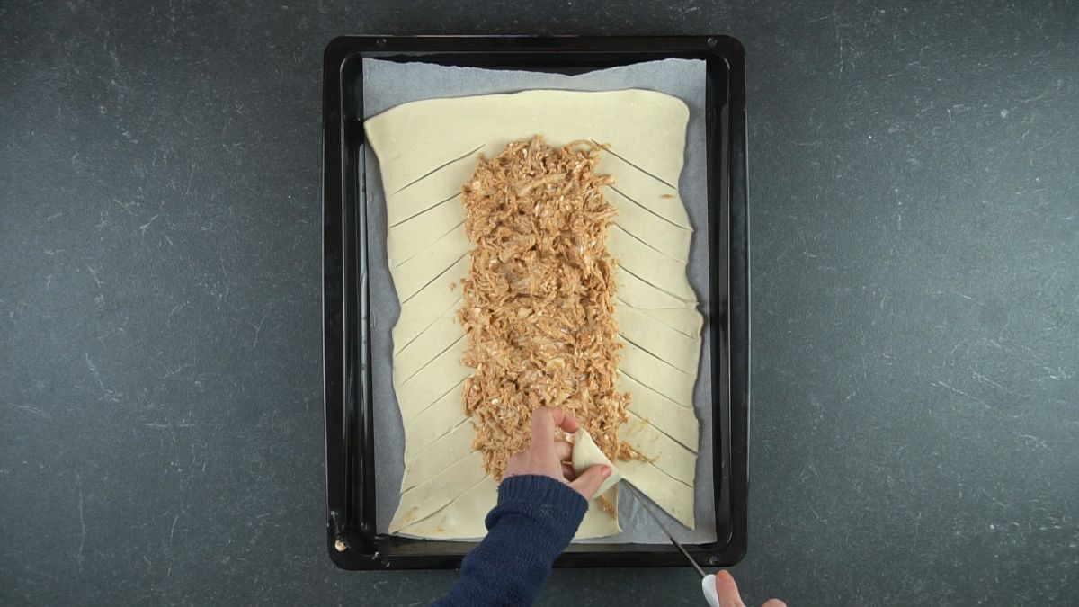 chicken in dough on baking sheet