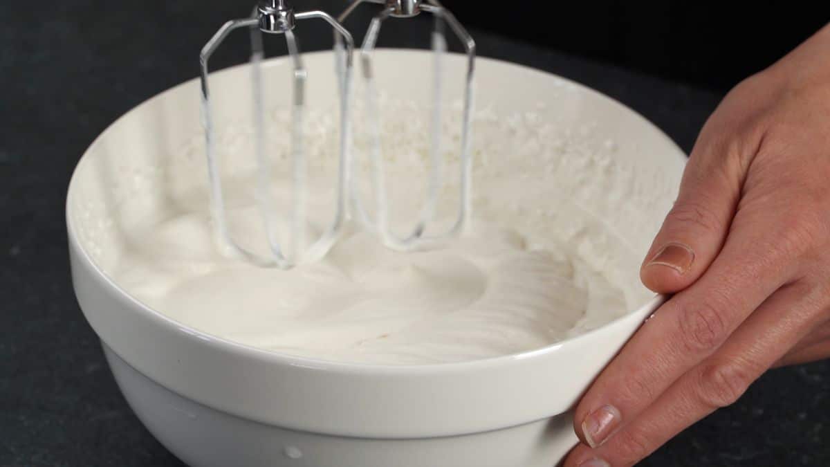whisk in bowl with cream for whipping cream