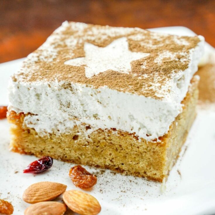 square of apple blondie cheesecake on white plate