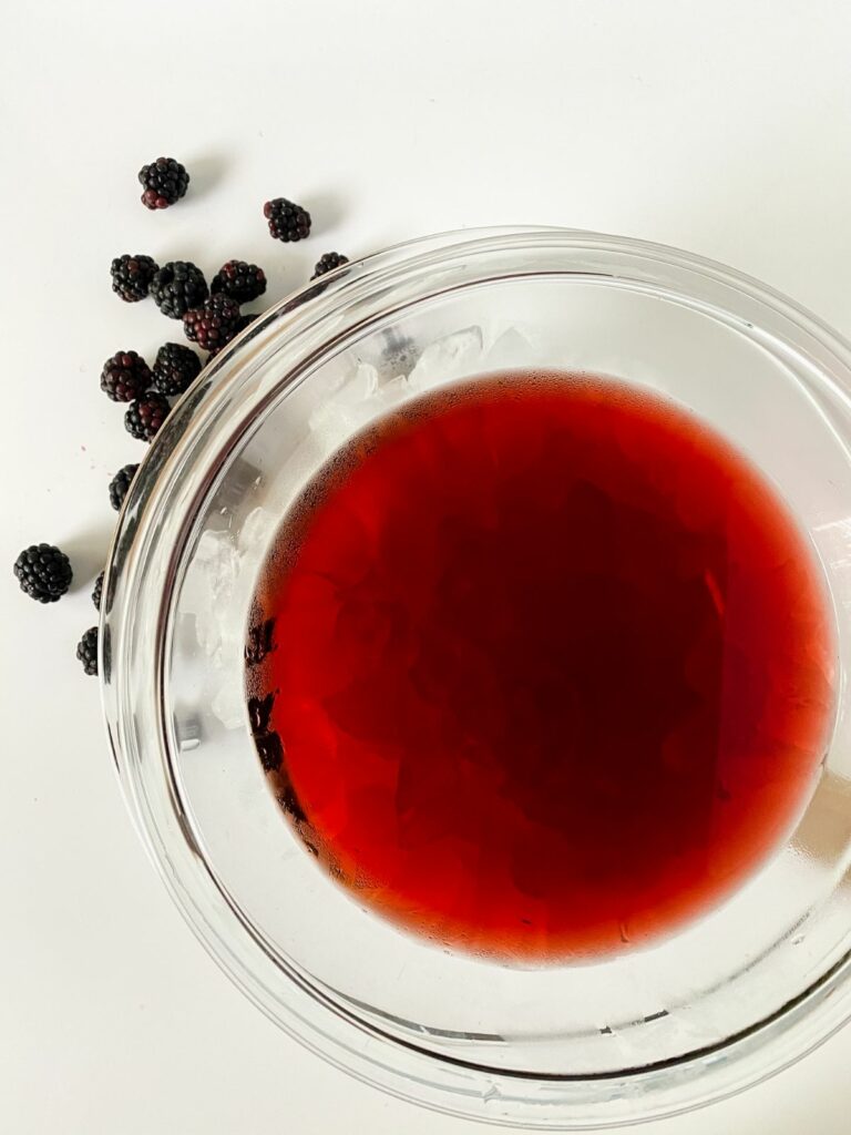 glass bowl of blackberry wine mixture