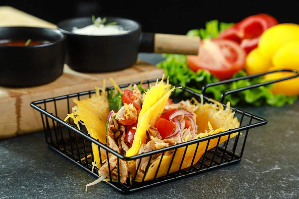 black wire basket filled with low carb cheese tacos