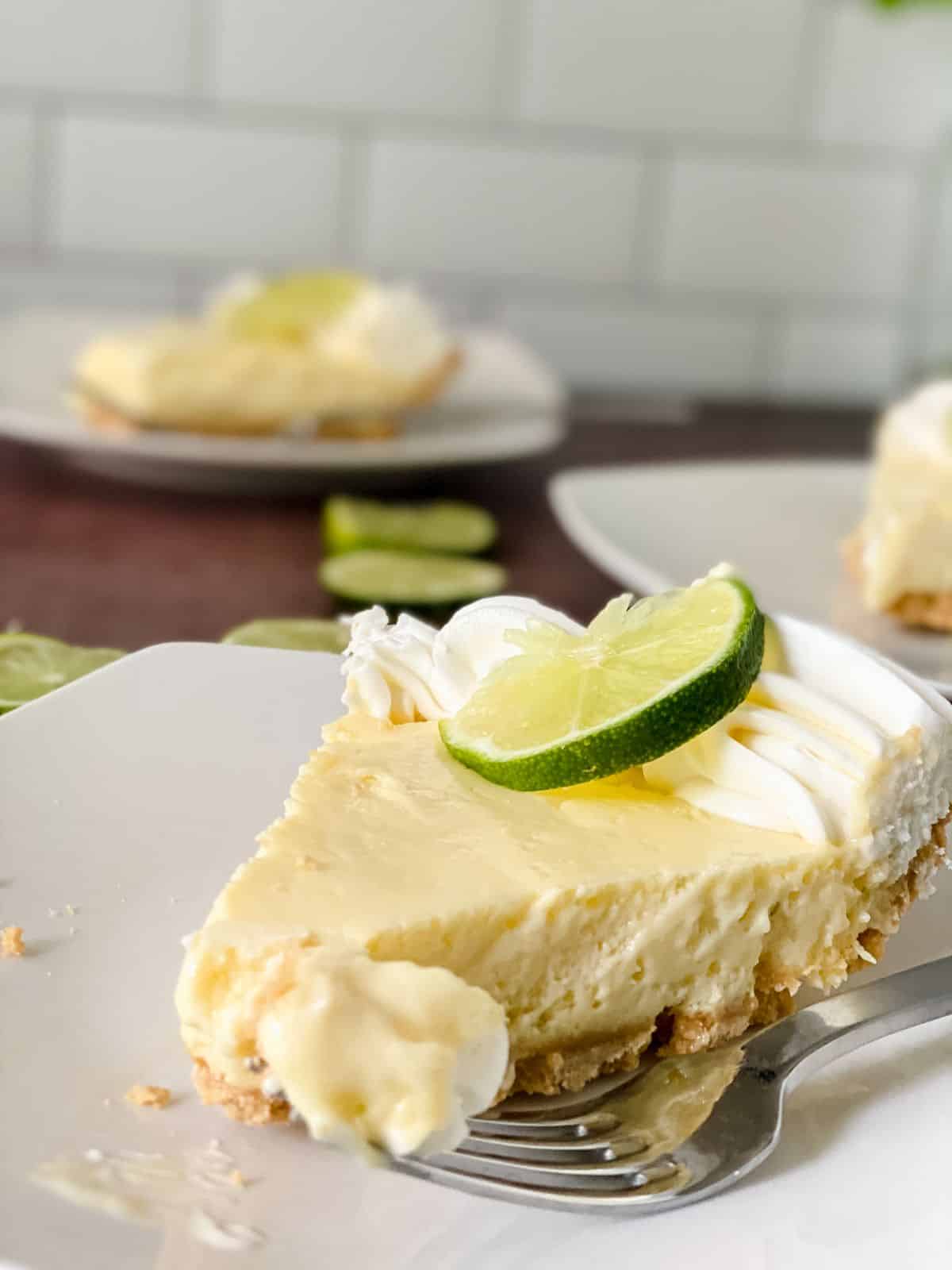slice of key lime pie on white plate