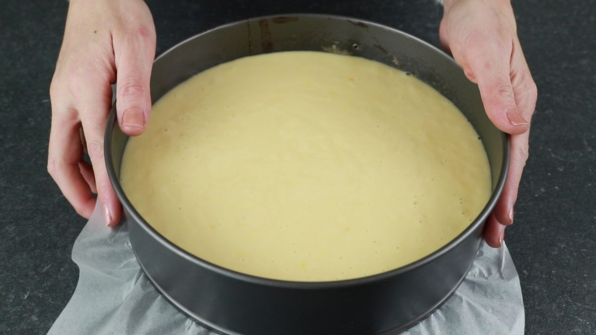uncooked cake batter in round cake pan