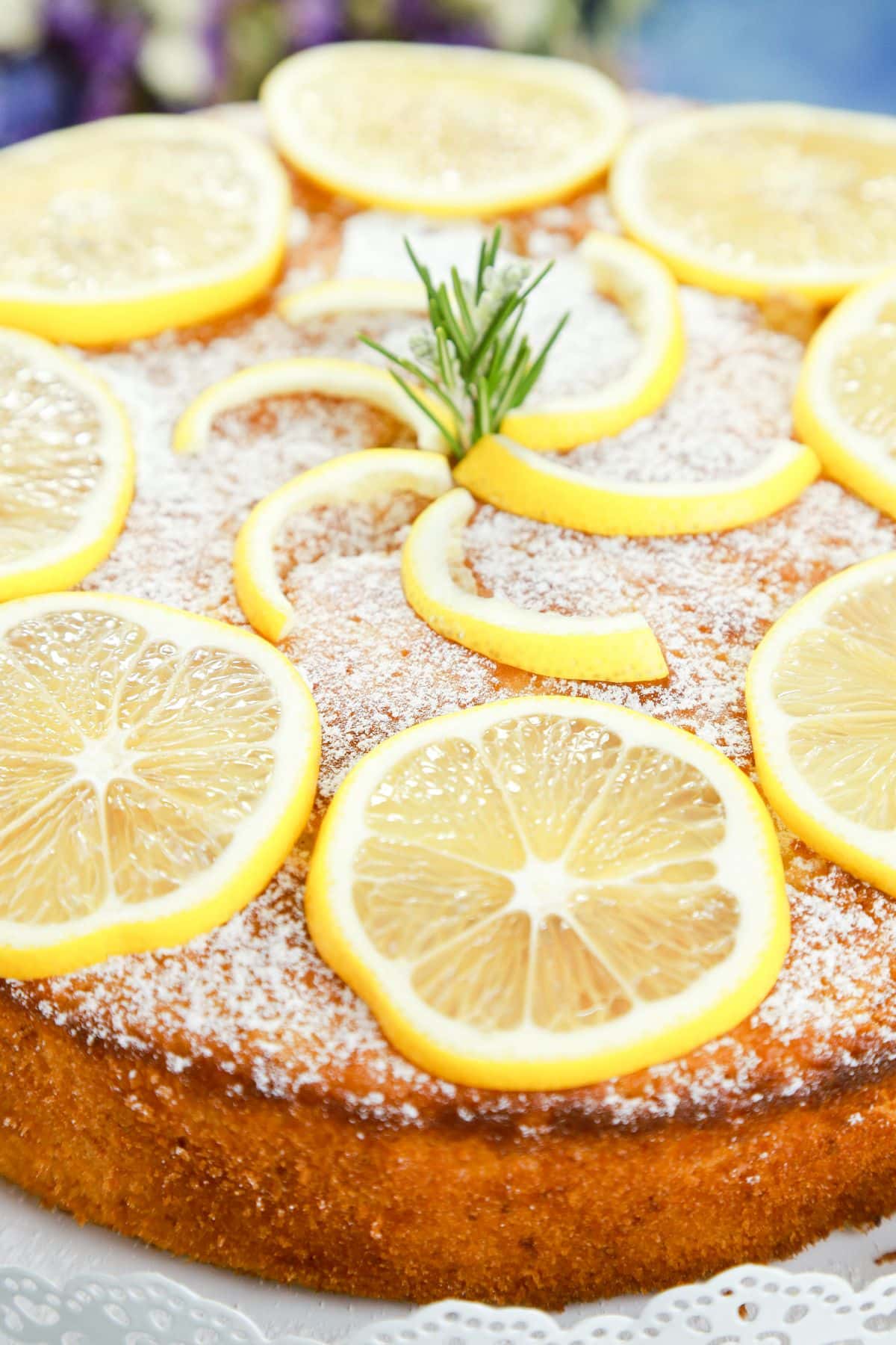 whole olive oil lemon cake on cake stand