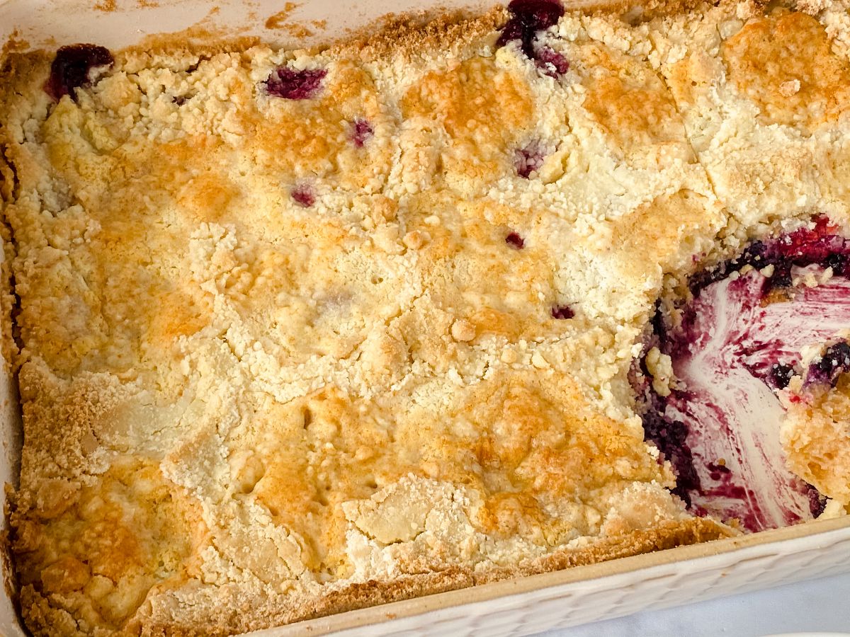baking dish of mixed berry dump cake with spoon removed