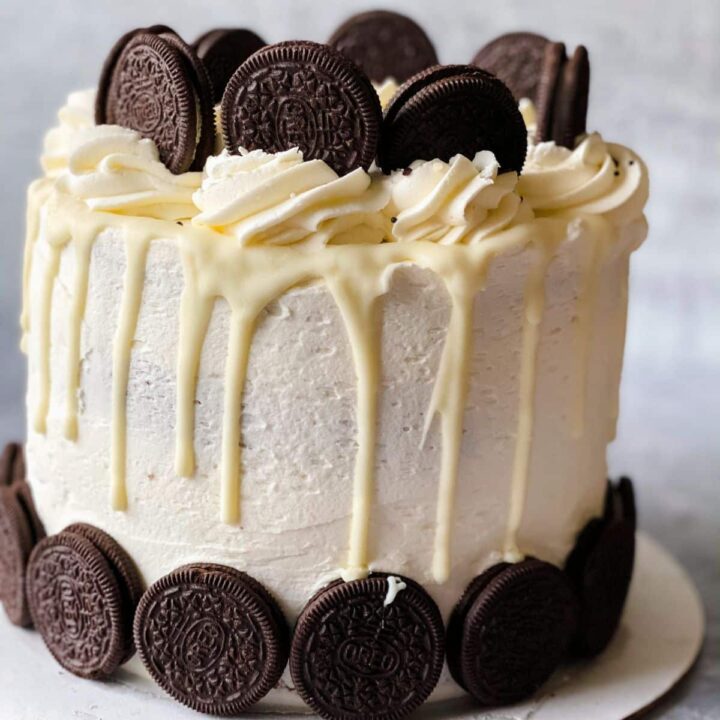 oreo cake on white plate with gray background