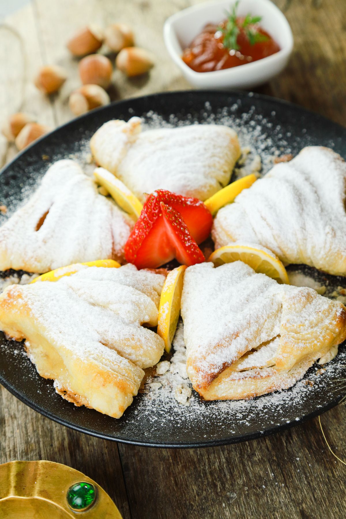 sfogliatelle on plate with sliced berries