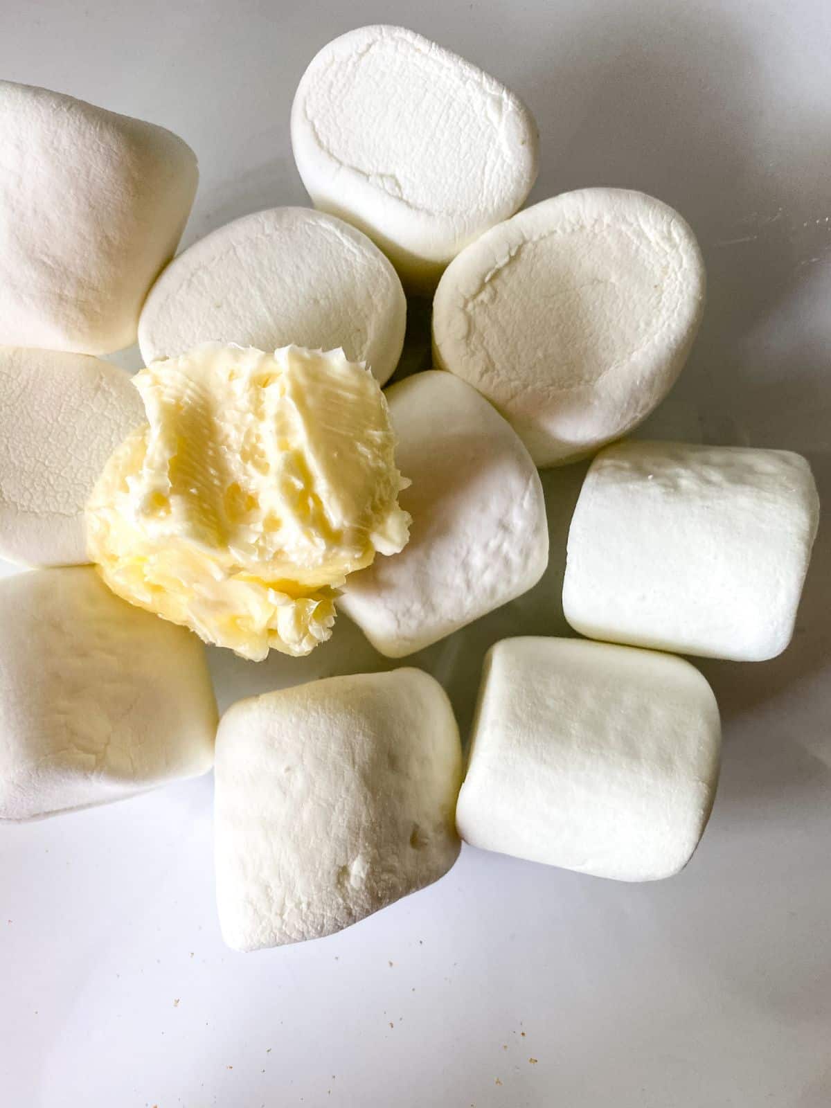 marshmallows and butter in glass bowl