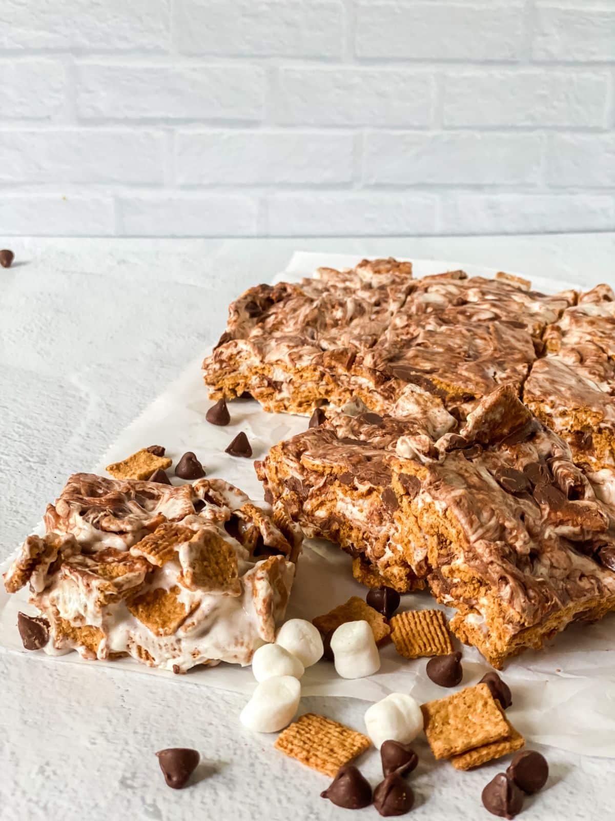 square of s'mores cereal bars on table with individual pieces