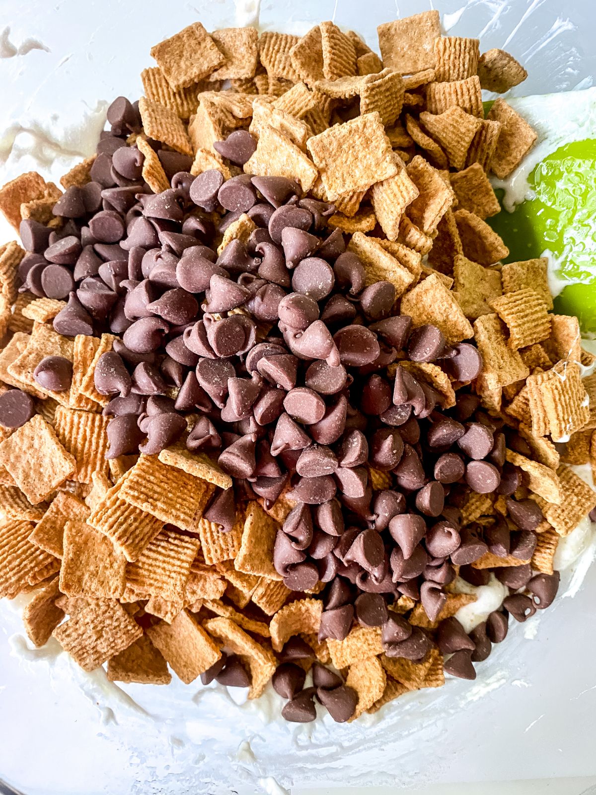 cereal pieces and chocolate chips on top of marshmallow