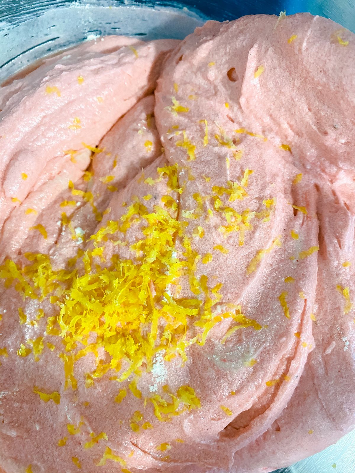 lemon zest on top of strawberry cupcake batter