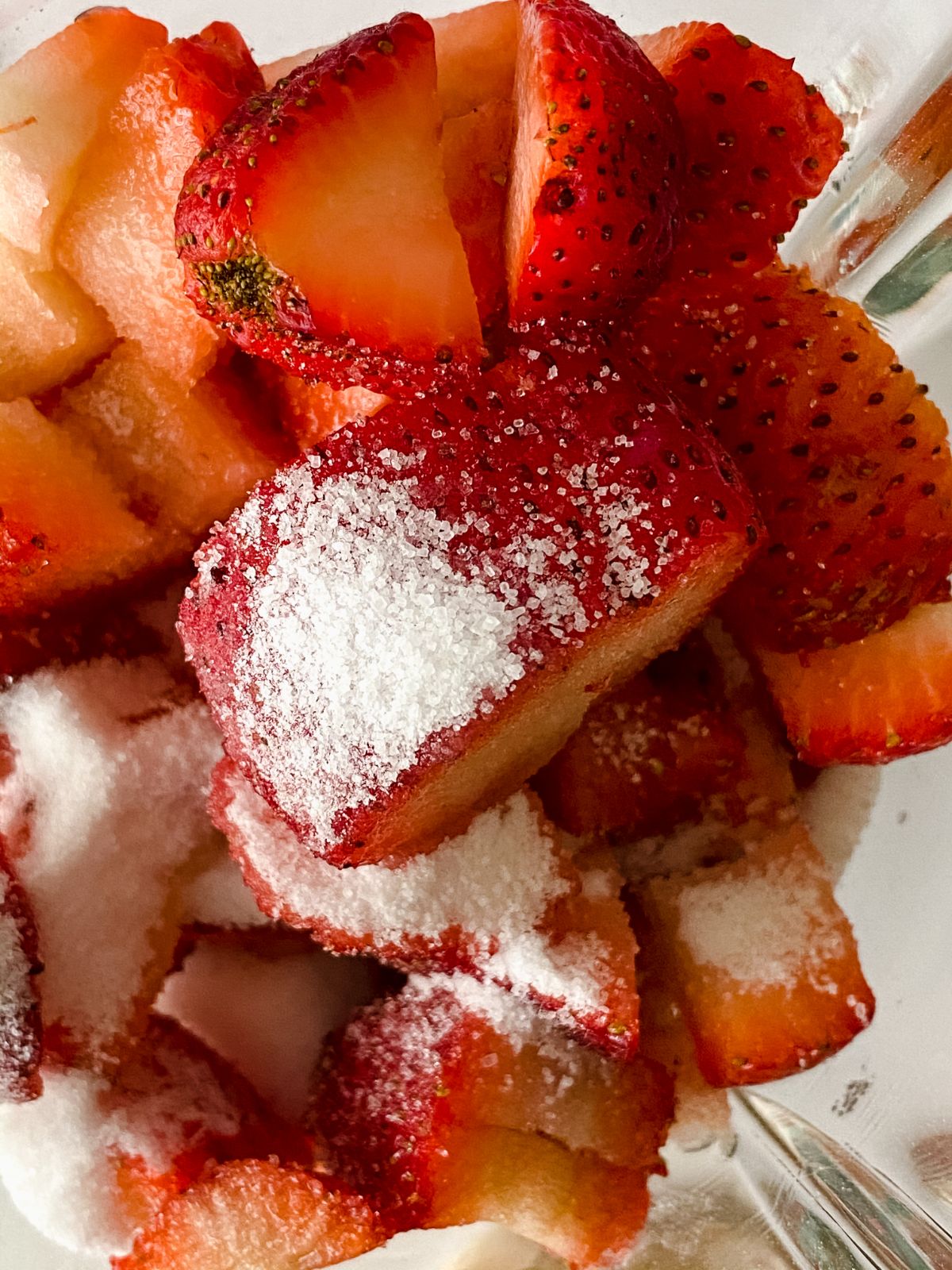 strawberries and sugar in bowl
