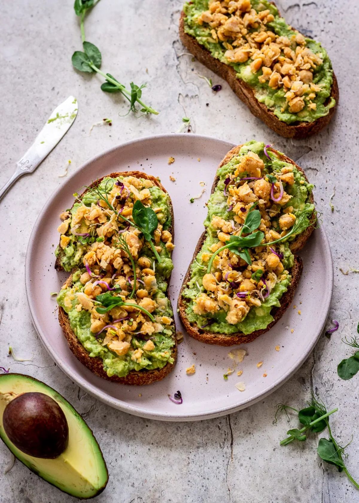 Protein-Packed Avocado Toasts on a pink plate.