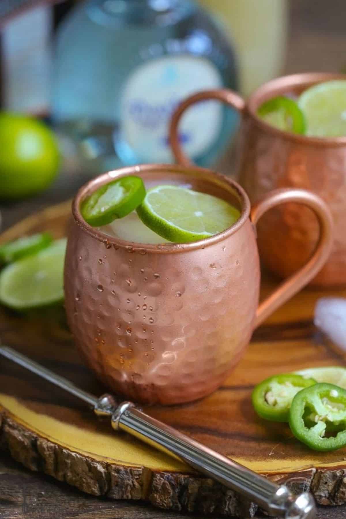 Mexican Mule cocktail with a slice of hot peeprm lime in a metal cup.