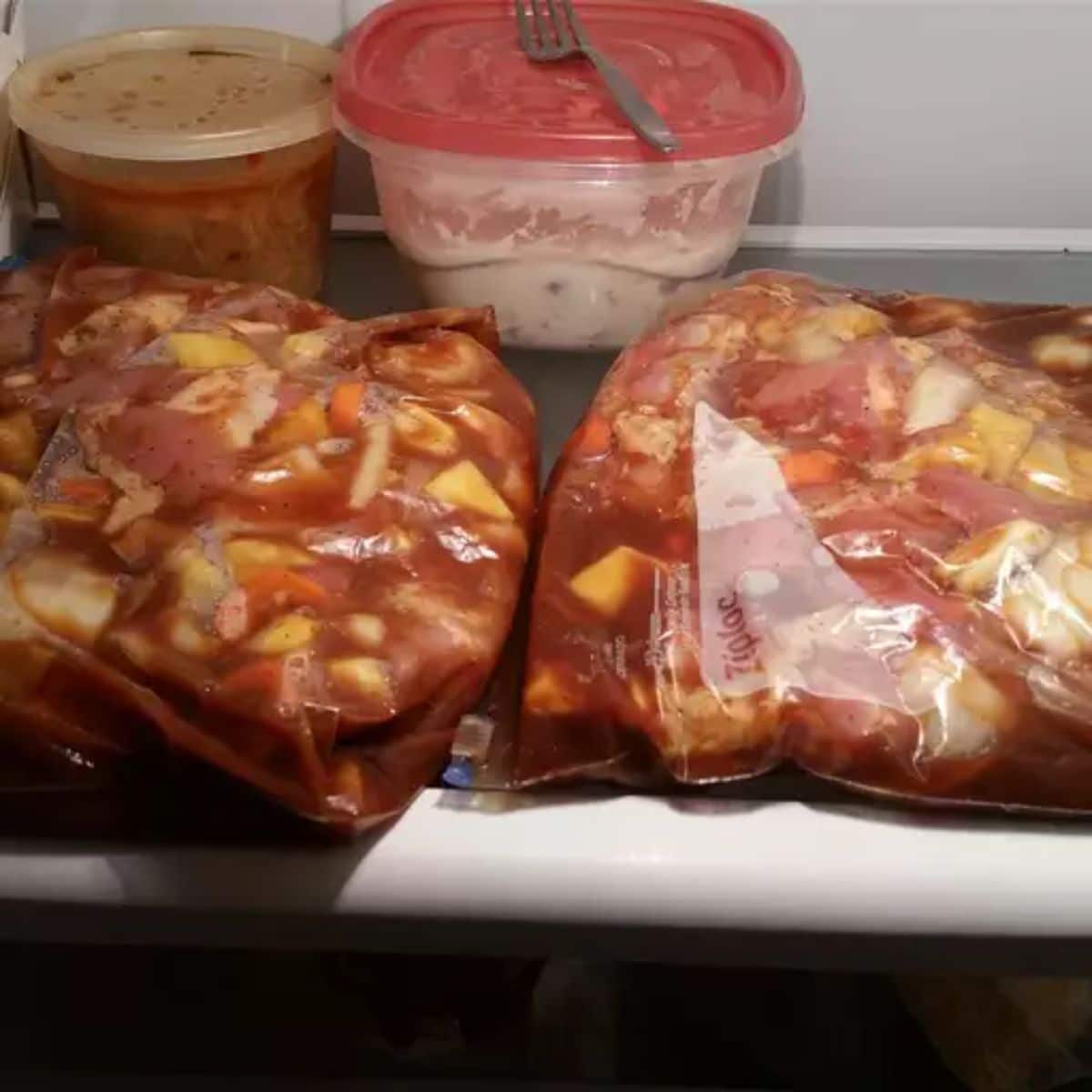 Rice Cooker Chicken packed in plastic bags in a fridge.