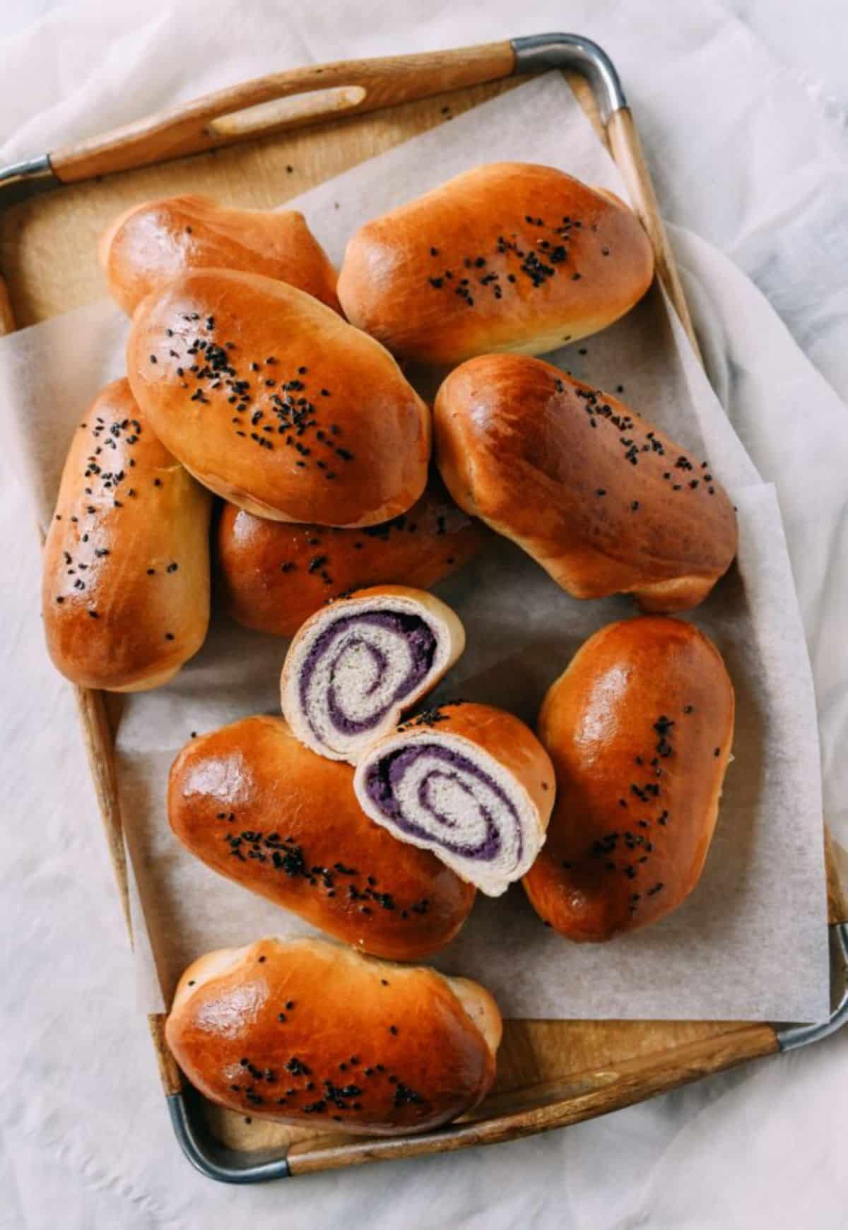 Pieces of Ube Buns on a tray.